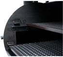 Close-up of the Old Country BBQ Pits G2 24x48 Offset Smoker with Insulated Firebox interior, showing two removable wire mesh cooking racks inside its dark, cylindrical chamber.