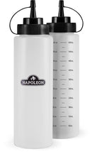 The Napoleon Griddle 4-Piece Cleaning Kit by Napoleon Grills includes two clear plastic squeeze bottles—one with measurement markings (ml/oz) and one with the Napoleon logo—ideal for griddle cooking, both with black nozzle caps and lids.
