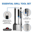 The Napoleon 3-Piece Starter Tool Set Essential Series (GATL002) by Napoleon Grills includes stainless steel spatula, tongs, and fork with ergonomic non-slip grips. The spatula has an aluminum bottle opener and each tool features the Napoleon logo.