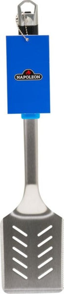 The Napoleon Grills Essential Series Grill Spatula (GATL003) is a stainless steel tool featuring a slotted head, ergonomic handle, and a blue Napoleon tag attached near the top.