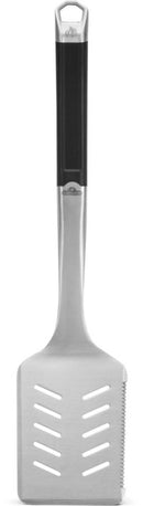 The Napoleon Grills PRO Series Premium Grill Spatula (GATL007) features a black handle, stainless steel serrated blade with diagonal slots, and offers durable, versatile performance for any BBQ enthusiast.