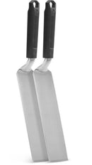 The Napoleon Grills Griddle Spatula 2-Piece Set (GATL011) features two stainless steel spatulas with black handles, standing upright side by side against a white background.