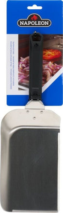 The Napoleon Griddle Scoop Spatula (GATL017) from Napoleon Grills features stainless steel construction, a black handle, and comes in blue and white brand packaging with grilled food pictured in the background.