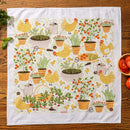 The Gingiber Garden Chicken Tea Towel by Gingiber features vibrant yellow chickens, tomato plants, herbs, and garden tools—perfect as a charming sourdough proofing towel for your wooden countertop.