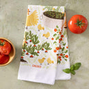 The Gingiber Garden Chicken Tea Towel by Gingiber, made from flour sack cotton, is shown on a textured surface with a whole tomato, tomato slices in a bowl, and fresh basil. Ideal as decor or for sourdough proofing.