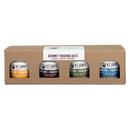 A brown cardboard B.T. Leigh’s Somethin’ to Finish With Gift Box - Gourmet Finishing Salts containing four small jars of gourmet finishing salt labeled with various herb and spice flavors.