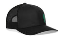 The Haka Hat Green Bigfoot Trucker Hat is a black Sasquatch snapback featuring a mesh back, solid front panel, and small green embroidered design on the left front.