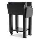 The Green Mountain Grills Trek Cart 2.0 is a black, rectangular metal grill cart with side panels, tall legs, a perforated lower shelf, and wheels on two legs for easy mobility—perfect for outdoor grilling.