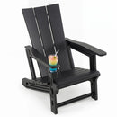 A glass of colorful layered drink sits in the cup holder of the DirectDeals Adirondack Chair with Cup Holder - HDPE Outdoor Seating, which is black and set against a white background.