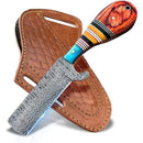 The Texan Knives Bull Cutter features a handmade Damascus steel blade and a striped Pakkawood-camel bone handle, resting on a brown leather sheath with stitched details and belt slots.