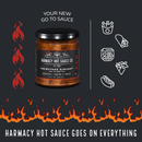 A jar of Harmacy Hot Sauce Co. Brimstone Inferno Extra Hot Tahini & Roasted Red Pepper Sauce 9oz is shown with flames, food icons (ramen, pizza, taco, burger, hot dog), and the text “Harmacy Hot Sauce Goes On Everything.”.