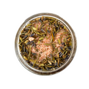 A glass jar of SALTOPIA Infused Sea Salts' Saltopia Herbs De Provence Seasoning Salt, a Pink Himalayan sea salt blend with dried herbs and seeds, is shown from above on a white background.