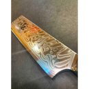 Close-up of the Spaceman Knives Interstellar Nakiri blade displaying detailed Damascus wavy patterns and a maker’s stamp, set against a dark background.
