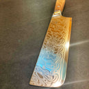 The Spaceman Knives Interstellar Nakiri, by Spaceman Knives, features a lustrous AUS-10 steel blade with an elegant Damascus finish and a wooden handle, shown resting on a dark surface.