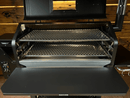 Two Pimp My Grill® Gen2 Slide-Out Rack System - 2 Racks metal grill racks installed inside a pellet smoker to expand the cooking space.