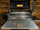A Green Mountain Grills Peak / Jim Bowie | Pimp My Grill® Gen2 Slide-Out Rack System - 2 Racks pellet grill with its lid open, featuring two stacked, slide-out cooking surfaces and a large front prep shelf.