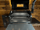 Pimp My Grill® Gen2 Slide-Out Rack System - 2 Racks installed in a pellet grill with its lid open, featuring a dual-level cooking system with two stacked, slide-out metal grill grates.