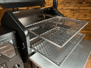 Two metal mesh Pimp My Grill® Gen2 Slide-Out Rack System - 2 Racks pulled out from a pellet grill, forming a dual-level cooking system.