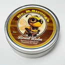 A round tin labeled Dr. B.Strong’s Cutting Board Balm from NULU Inc. features a cartoon bee in a superhero costume. This food-safe wood conditioner is designed for wood, made with beeswax and mineral oil, and the tin holds 8 oz.