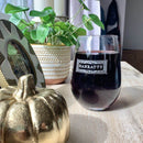 A Stemless Wine Glasses - Set of 4: The Diamond filled with red wine, featuring the name HANRATTY etched in a decorative rectangular border.