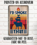 Wooden sign with barbecue design and text 'I'd Smoke That' on a white brick wall background.