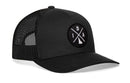 The Haka Hat Idaho Trucker Hat | Black IDA X Snapback features a black and white snapback design, mesh back, and a round patch with “I”, “D”, “A”, and the Idaho outline in an X—perfect for showing your Idaho pride.