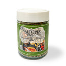 A clear jar of SALTOPIA Infused Sea Salts Italian Herbs Flavor Low Sodium: AMORE, with a white lid. The green label shows herbs, garlic, and tomatoes. Enjoy this healthy 4 oz low sodium Italian herb blend—perfect for cooking.