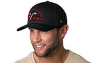 Man wearing the Haka Hat JBR x Haka Red Bison Black Buffalo Snapback, featuring a red and white bison patch logo and a small H logo on the side, against a white background.