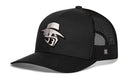 The Haka Hat JBR Silver Logo is a black, comfort-fit trucker snapback with a mesh back and metallic leather design, featuring a silver embroidered James Bigley Ranches logo of a stylized figure in a wide-brimmed hat and mask.