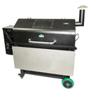Black Green Mountain Grills Jim Bowie / Peak pellet grill with a Pimp My Grill® Stainless Steel Shelf Extension / Sleeve, a windowed lid, and bright green wheels.