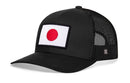 The Haka Hat Japanese Flag Trucker Hat is a black mesh snapback featuring an embroidered Japanese flag patch with a red circle on white, sewn on the front. Enjoy style and comfort with this Black Japan Snapback from Haka Hat.