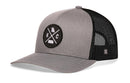 The Haka Hat Kansas City Trucker Hat features a gray front, black mesh back, KC X patch with Kansas and Missouri outlines, and an adjustable snapback for comfort. By Haka Hat.