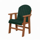 The Kanyon Living Poly Lumber Fixed Dining Height Chair features a dark green slatted seat and back with cedar wood-toned armrests and legs—classic, Amish-made outdoor furniture, shown against a plain white background.