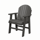 The Kanyon Living Poly Lumber Fixed Dining Height Chair Deluxe in Driftwood Grey features a slatted back and seat, wide armrests, and sturdy legs for comfortable outdoor seating, shown against a plain white background.