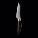 The Messermeister Kawashima Paring Knife - 3.5" features a shiny SG2 powdered steel blade and a dark wooden handle, shown standing upright against a solid black background.