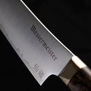 Close-up of the 6" Messermeister Kawashima Utility Knife blade, featuring Messermeister and Japanese engravings and a dark wood handle—ideal for precise prep—set against a black background.