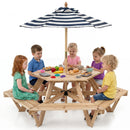 Five children sit at the DirectDeals Kids Hexagonal Picnic Table with Umbrella and 6 Benches, playing with toy food and kitchen items. The background is plain white.
