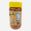 A clear plastic jar with a yellow lid, filled with Culture Hot Sauce Kitchen Sink Rub by Culture Hot Sauce. The label displays nutrition facts and ingredients. This all-in-one spice blend is coarse and reddish-brown in color, making it the perfect BBQ seasoning for any dish.
