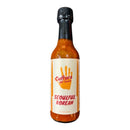 A bottle of Culture Hot Sauce Seoulful Korean by Culture Hot Sauce, featuring an orange handprint on the label. This fermented hot sauce offers a vibrant reddish-orange hue and is crafted in the style of a ginger kimchi hot sauce for an authentic Korean kick.
