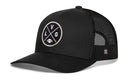 The Haka Hat Las Vegas Trucker Hat is a black mesh snapback with a curved bill and a circular patch featuring intersecting L, V, G letters and a football icon on the front.