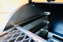 Interior of a Traeger Ironwood 885 showing two metal slide-out rack rails from the Pimp My Grill® Gen2 Slide-Out Rack System - 2 Racks mounted on the side wall.