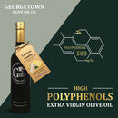 A bottle of Georgetown Olive Oil Co. LEMON GARLIC Infused | High Polyphenols Extra Virgin Olive Oil is displayed with a tag. Hexagons highlight “Polyphenols 580 mg/kg.” The text states: “HIGH POLYPHENOLS EXTRA VIRGIN OLIVE OIL.” This delicious lemon garlic infused olive oil by Georgetown Olive Oil Co. is crafted as a high polyphenols extra virgin olive oil for exceptional flavor and health benefits.