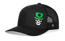 The Haka Hat Leprechaun Skull Trucker Hat by Haka Hat features a black rubber patch of a skull in a green St. Patrick’s Day hat with shamrock, yellow buckle, and orange band. This snapback has a curved bill and breathable black mesh back panels.