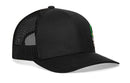The Haka Hat Leprechaun Skull Trucker Hat is a black snapback with a mesh back, solid front panel, slightly curved bill, and features a colorful leprechaun skull rubber patch on the front right.