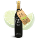 A bottle of Georgetown Olive Oil Co. Persian Lime Fused | High Polyphenols Extra Virgin Olive Oil, crafted by Georgetown Olive Oil Co. using the traditional agrumato method, stands in front of a lime slice, with a tan tag featuring a lime graphic and product details hanging from the neck.