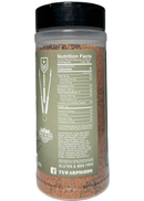 A clear spice jar with a black lid displays nutrition facts, ingredients, and labels such as Gluten & MSG Free and Made in USA on its green label. The jar is filled with War Pig Little Bird BBQ Rub by WarPig BBQ—a reddish-brown blend perfect for use as a chicken or poultry seasoning.