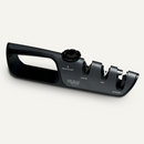 The NULU Adjustable Knife Sharpener by NULU Inc. is a black sharpener equipped with labeled slots for coarse, fine, and scissor sharpening. It features an angle adjustment dial and a secure-grip handle.