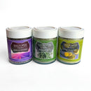 Three jars of SALTOPIA Infused Sea Salts from the Saltopia Mediterranean Kitchen Gift Set—Herbs de Provence (purple), Rosemary Salt (green), and Lemon Thyme Salt (yellow-green)—are displayed side by side on a white background.