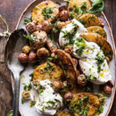 Roasted potatoes with fresh herbs and creamy cheese, finished with SALTOPIA Infused Sea Salts from the Saltopia Mediterranean Kitchen Gift Set, served on a wooden table with a rustic spoon.