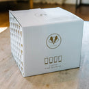 White gift box containing a set of four Pint Glasses - Set of 4: The Diamond by Swanky Badger, featuring a badger logo and the text Custom Pint Glasses printed on the front.
